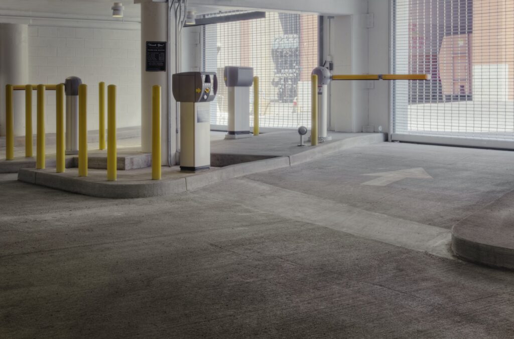 Entrance to car park with automated barrier.